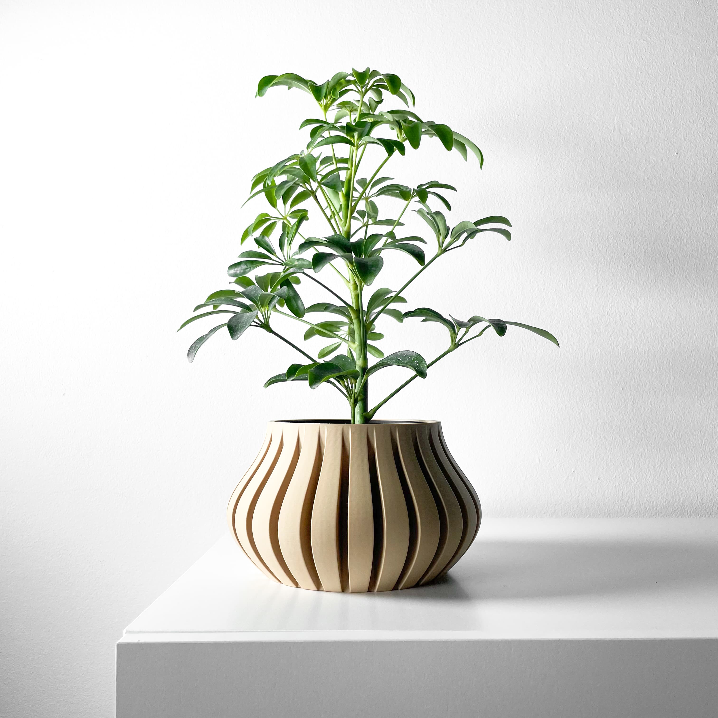 The Toril Planter Pot With Drainage Tray & Stand Included